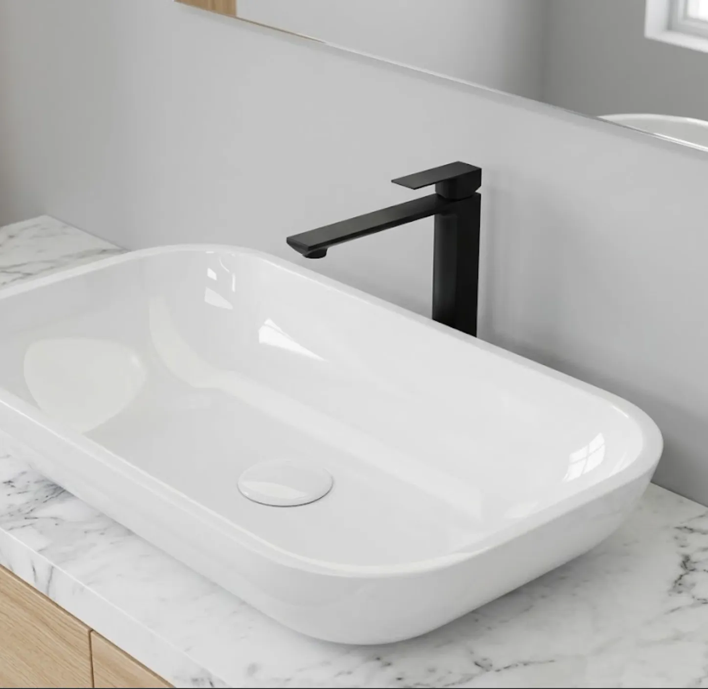 Rubinetto nero opaco su lavabo bianco